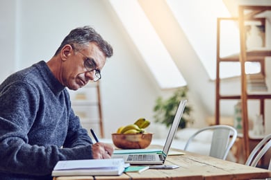 male adult degree completion student working on computer