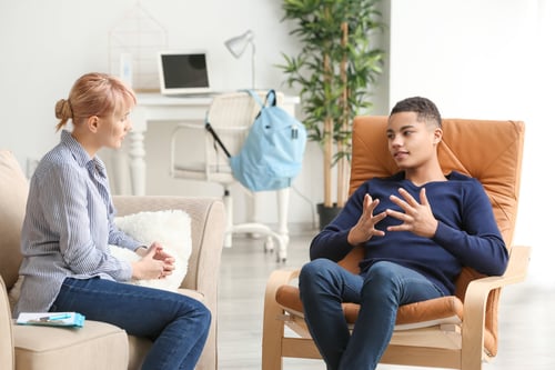 Counselor working with a young client