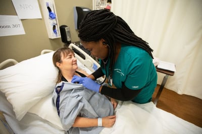 Nursing student caring for a patient